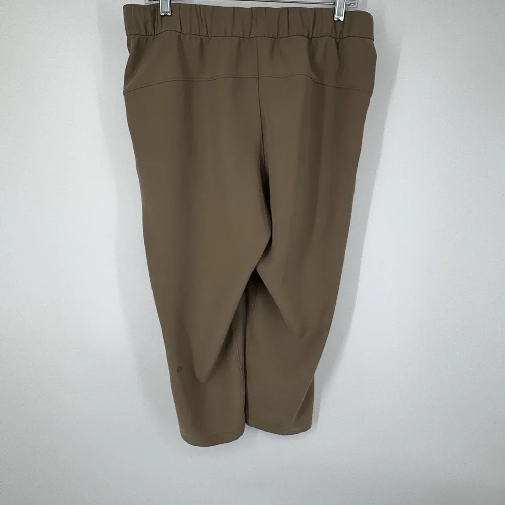 Lululemon‎ On The Fly Crop Pants Size 10 Khaki Woven Drawstring Stretch Casual